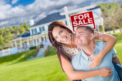 Playful Excited Military Couple In Front of Home with For Sale R