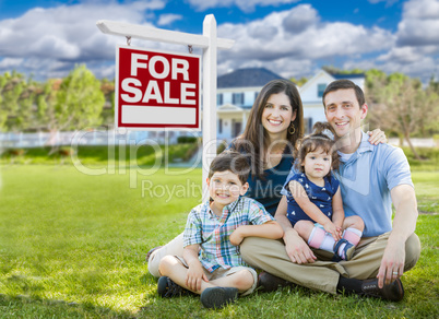 Young Family With Children In Front of Custom Home and For Sale