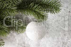 Branch of spruce with decoration in the snow