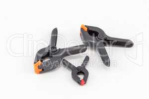 Three spring clamps for a photographic studio.
