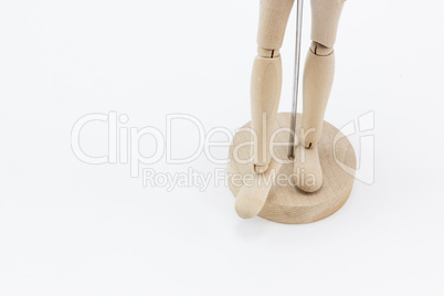 The legs of a wooden mannequin.