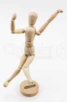wooden mannequin in an indian dance pose.