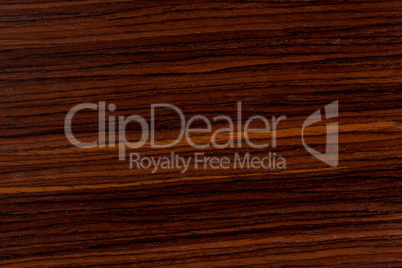 Dark rosewood background, natural wooden texture with patterns.