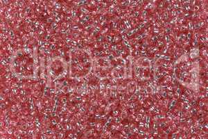 Pink glass beads for background.