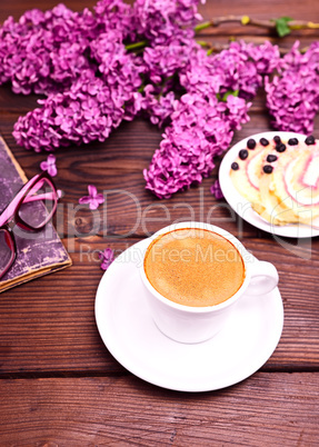 Espresso coffee in a white cup with a saucer