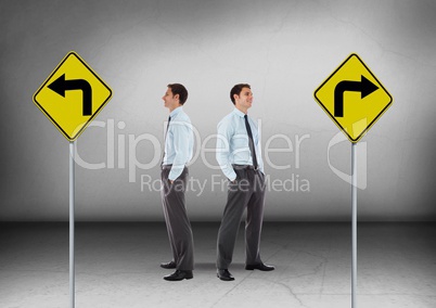 Left or right arrows on road signs with Businessman looking in opposite directions