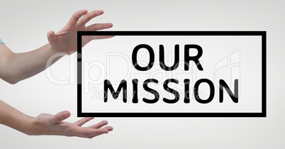 Hands interacting with our mission business text against white background