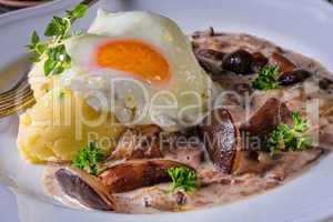 Forest mushroom sauce with fresh mushrooms, potato and poached e