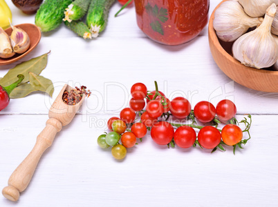 cherry tomatoes and spoon with spices