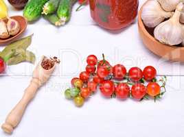 cherry tomatoes and spoon with spices