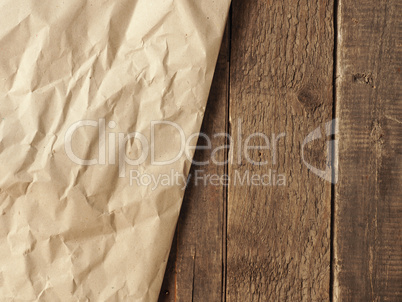 Crumpled paper on wood