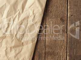 Crumpled paper on wood