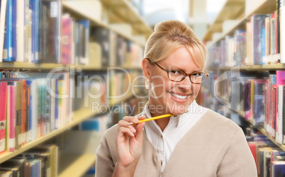 Beautiful Expressive Student or Teacher with Pencil in Library.