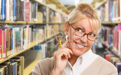 Beautiful Expressive Student or Teacher with Pencil in Library.