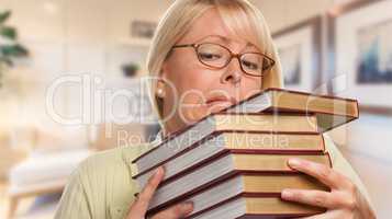 Beautiful Expressive Student or Businesswoman with Books in Offi