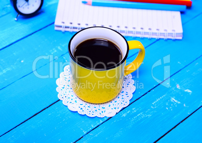 Black coffee in a yellow mug