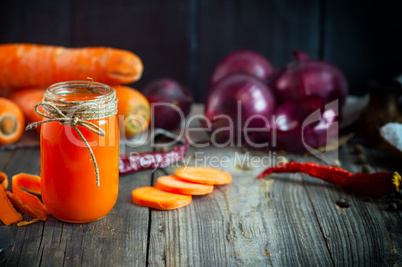 Carrot juice in a glass jar