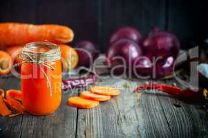 Carrot juice in a glass jar