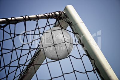 Blank Soccerball in net. Concept for goal achieved