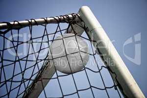 Blank Soccerball in net. Concept for goal achieved