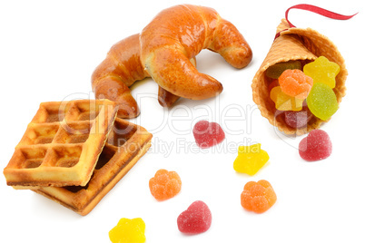 Croissants, waffles and marmalade isolated on white