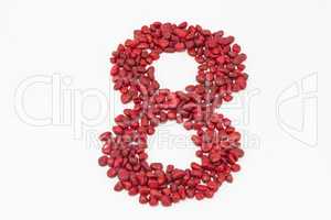 The number eight, made by red stones.