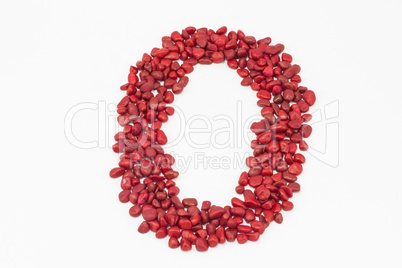 The number zero, made by red stones.