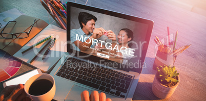 Composite image of digital image of mortgage web page and couple holding key