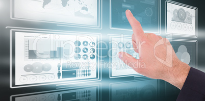 Composite image of businessmans hand pointing in suit jacket