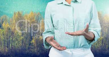 Businesswoman in nature forest explaining with hands