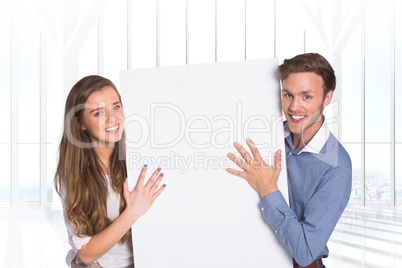 Business people holding blank card in office