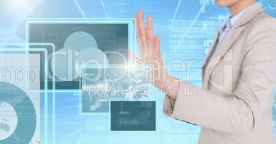 Businesswoman touching and interacting with technology interface panels