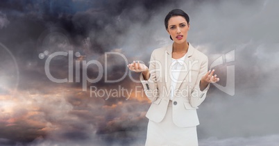 Businesswoman in front of twilight sky