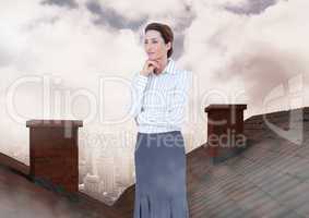 Businessman standing on Roofs with chimney and cloudy city
