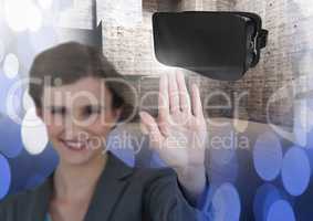 Woman touching and interacting with virtual reality headset with transition effect