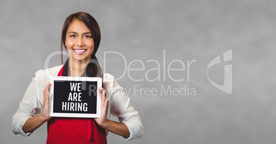 Business woman holding a tablet with we are hiring text