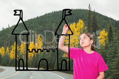 Girl drawing a castle on the road