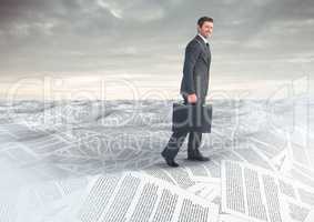 Businessman with briefcase in sea of documents under sky clouds