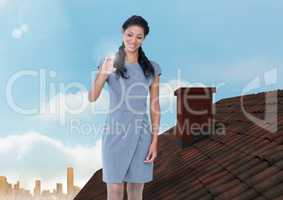 Businesswoman standing on Roof with chimney and city sky