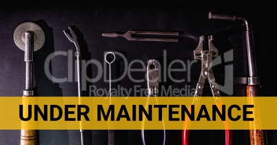 Under maintenance text against tools photo