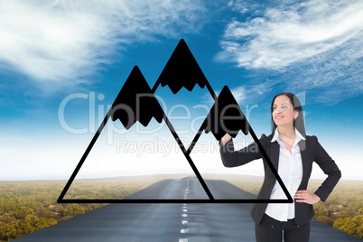 Business woman drawing mountains on the road