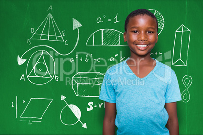 Composite image of portrait of smiling boy standing