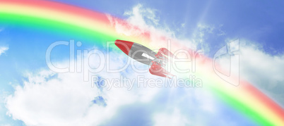 Composite image of red toy rocket