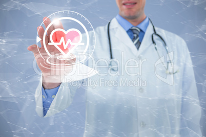Composite image of doctor touching an digital screen