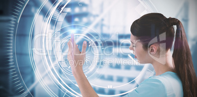 Composite image of young woman using imaginative digital screen