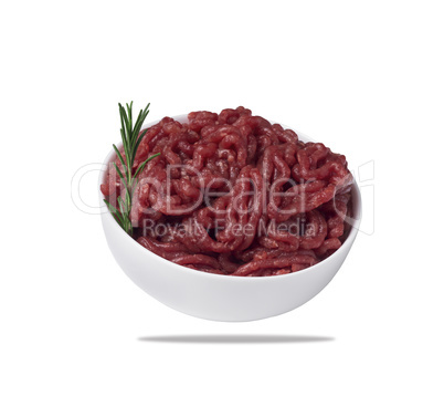 Minced meat in a bowl, isolated on a white background.