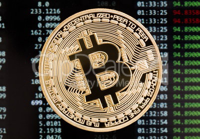 Golden bitcoin cryptocurrency coin on a circuit board background