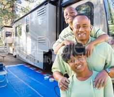 Happy African American Family In Front of Their Beautiful RV At