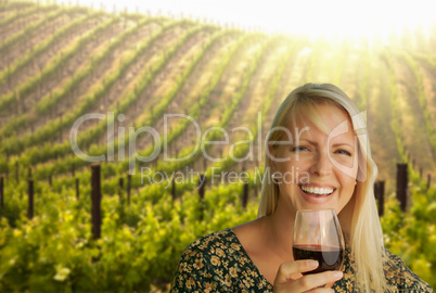 Attractive Young Woman With Wine Glass in A Vineyard.