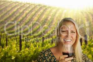 Attractive Young Woman With Wine Glass in A Vineyard.